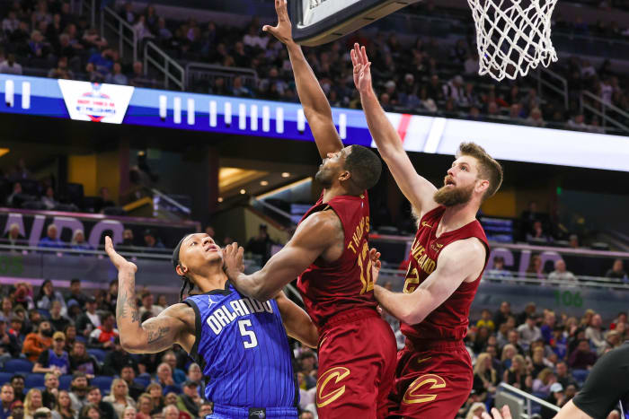Orlando Magic forward Paolo Banchero (5) is fouled by Cleveland Cavaliers center Tristan Thompson (12) during the second half at Amway Center.